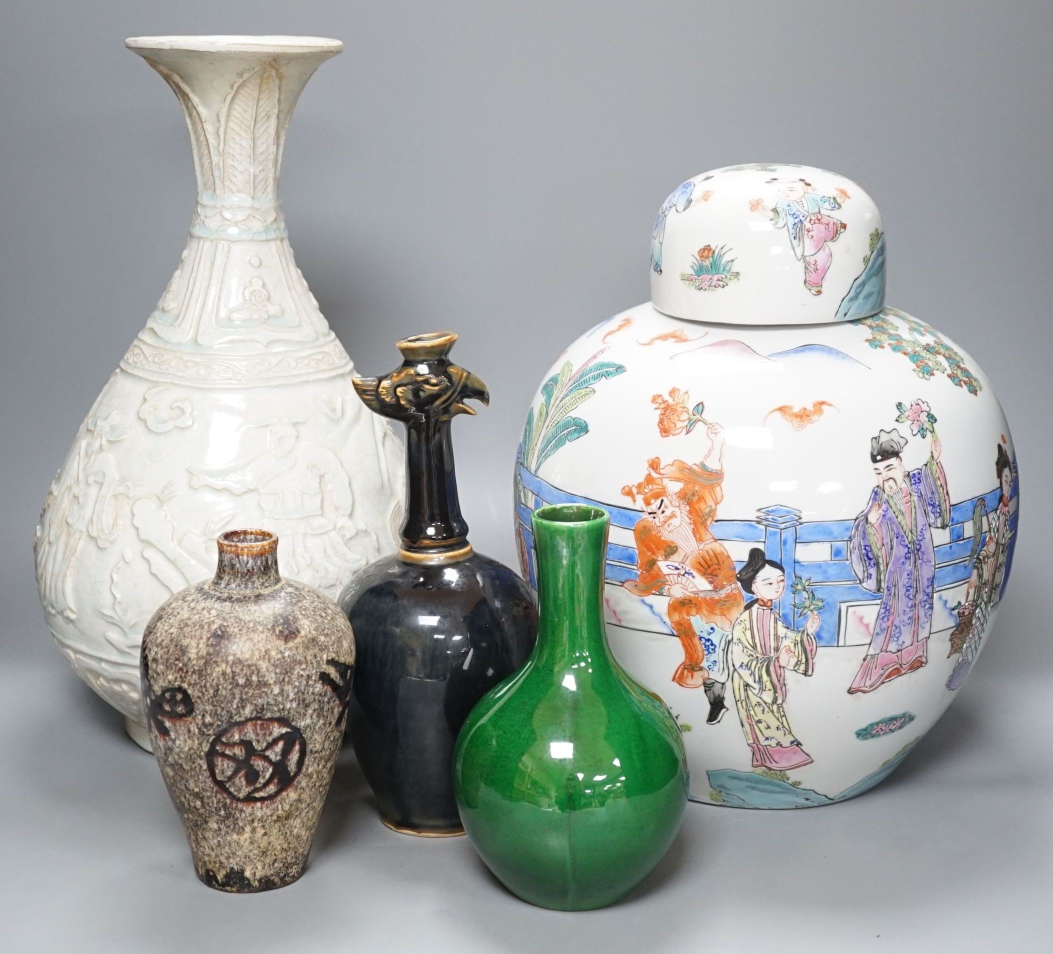 A Qingbai type bottle vase, a jar and cover, an apple green crackle glazed vase, a paper cut vase and a Song Dynasty style phoenix head bottle, tallest 38 cms high. (5)